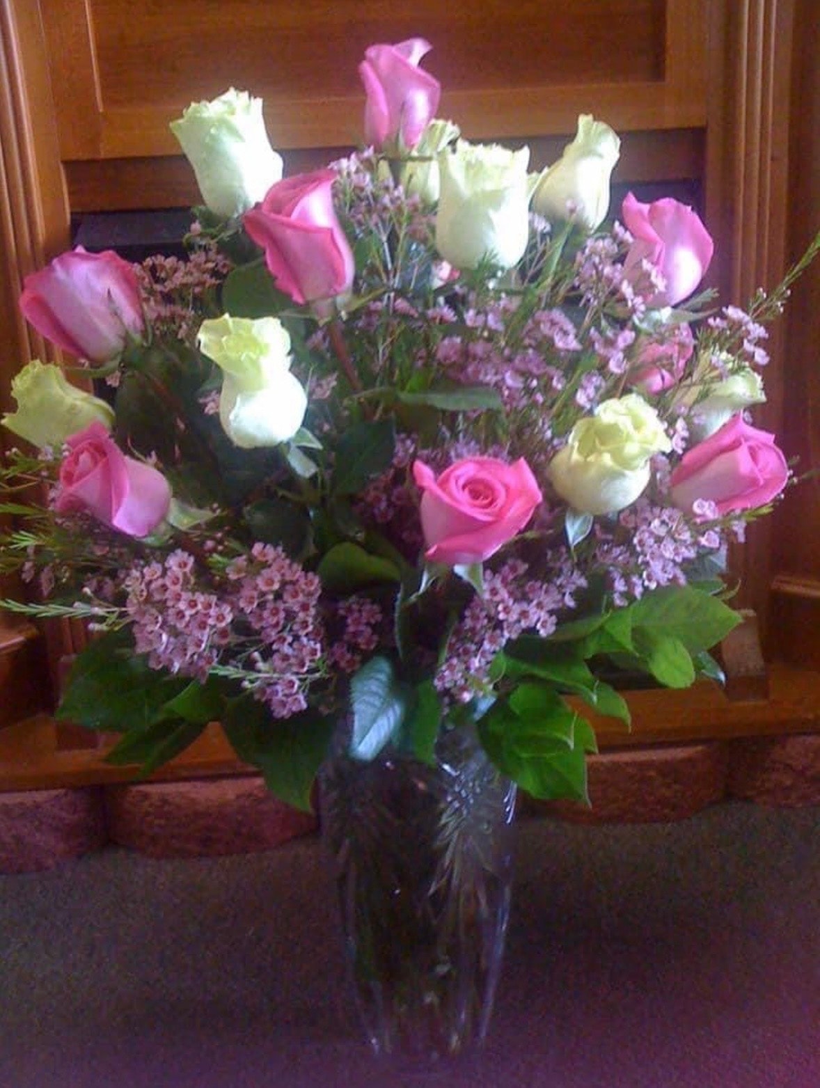 Everyday floral arrangement with pink roses, white carnations and purple filler flowers