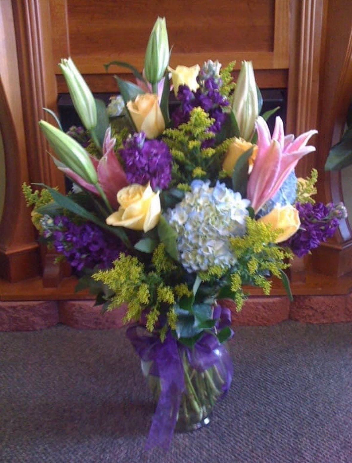 Everyday floral arrangement with roses, lilies, hydrangeas and purple accents